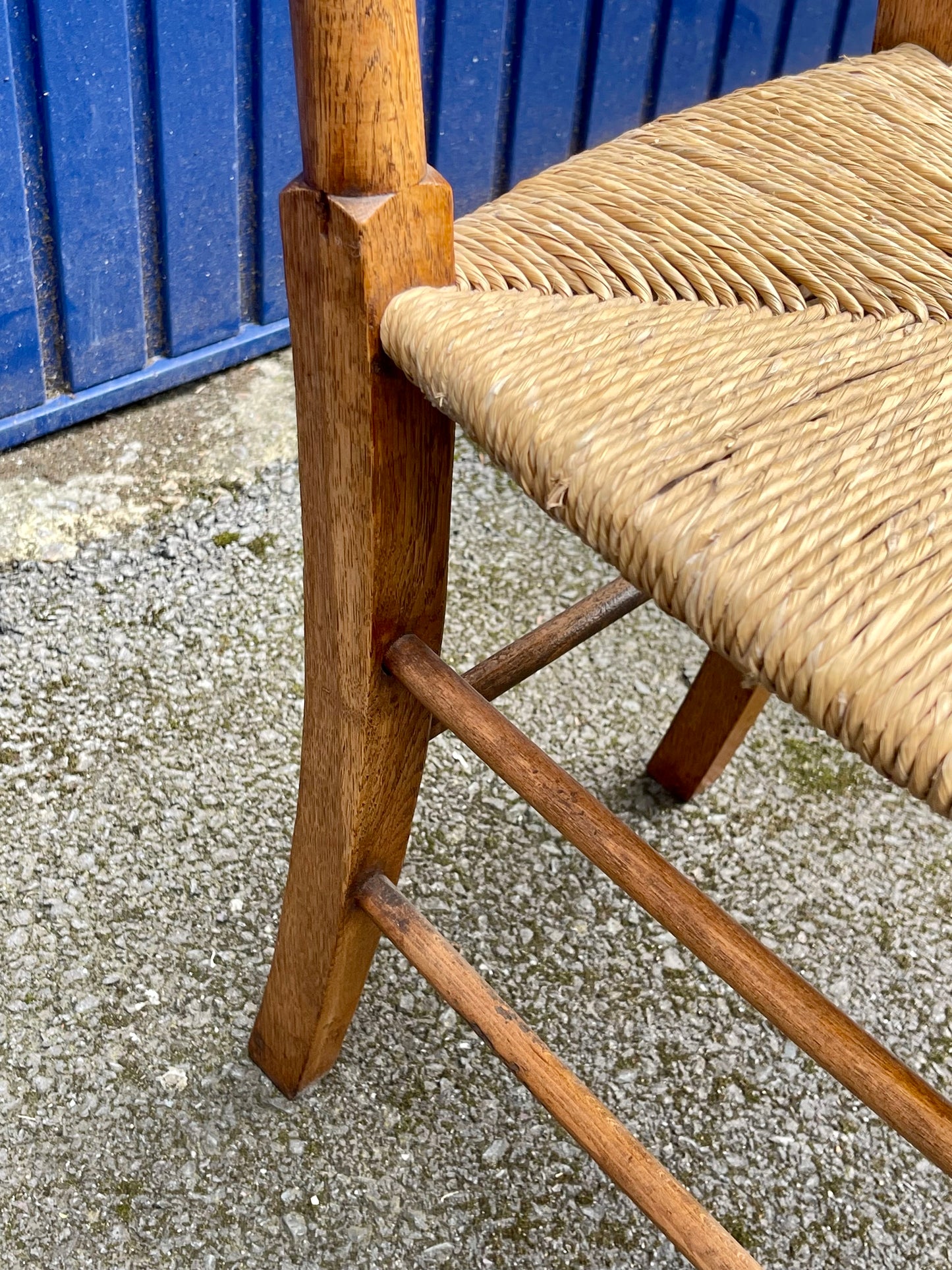 A Set Of Five Arts And Crafts Oak Rush-Seated Ladder Back Dining Chairs